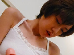 Short-haired Japanese woman Akina Hara tests her new realistic dildo